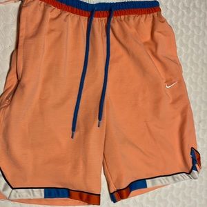Salmon colored Men’s Basketball Shorts. Slightly Used